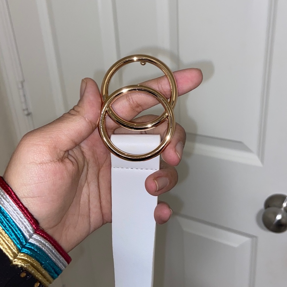 White belt with gold buckle